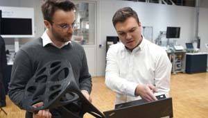 two technicians discussion about a 3D printed chair for the industrial video